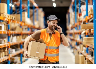 A delivery service man talking on voice picking headset and holding order.
