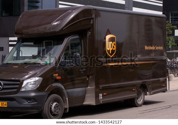 Delivery truck from UPS side view. United\
Parcel Service of America is the world\'s largest package delivery\
company. Copenhagen, Denmark - June 25,\
2019.