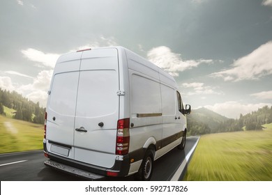 Delivery van drives a day on a country road