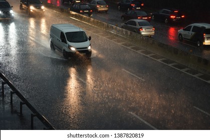 Delivery Van Speeding By Highway In Rain Night