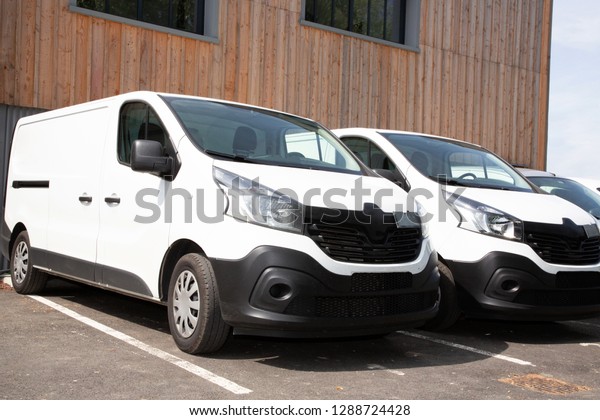 delivery vans ready to leave
to deliver the parcels, park in front of the head office of the
company