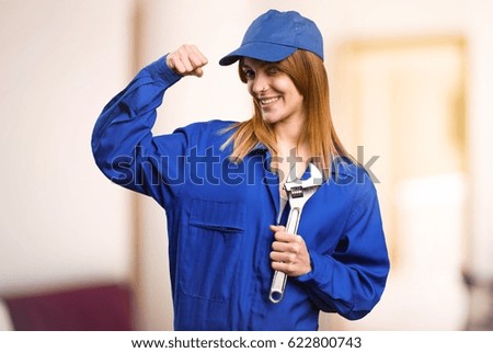 Delivery woman making strong gesture on defocused background
