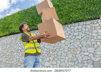 Delivery worker dropping a stack of packages, symbolizing the challenges, effort, and occasional mishaps involved in last-mile delivery and e-commerce logistics