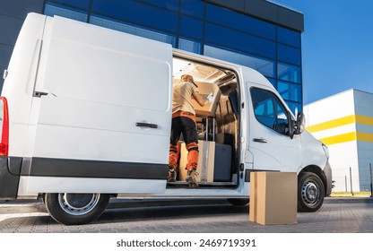 Delivery Worker Loading Boxes Into Van - Powered by Shutterstock