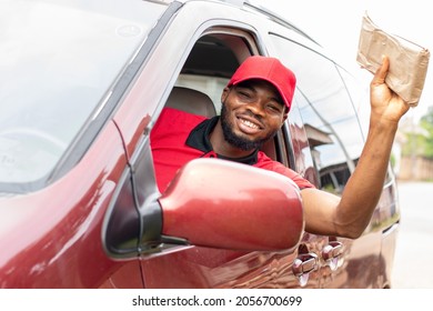 Delivery Worker Waving A Package At Someone To Get Their Attention