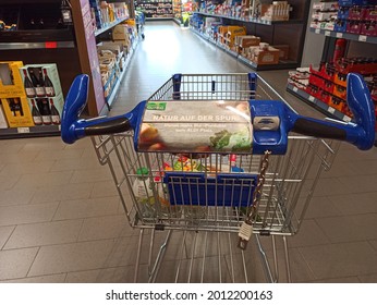 Delligsen, Germany, 7.7.2021 - A Shopping Trolley In The Aldi Market With Various Foods