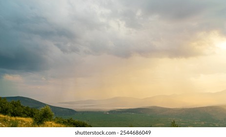 Delphi, Greece. Clouds with rain over the valley. Northern coast of the Gulf of Corinth, Itea Bay