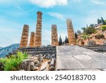 Delphi with ruins of the Temple of the ancient Sanctuary of Apollo in Delphi, Greece, at the Mount Parnassus