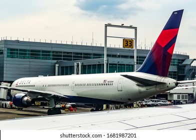 Delta Air Lines airplanes stand parked at the John F. Kennedy Airport (JFK Airport) in New York. Queens, New York. July 3, 2016.