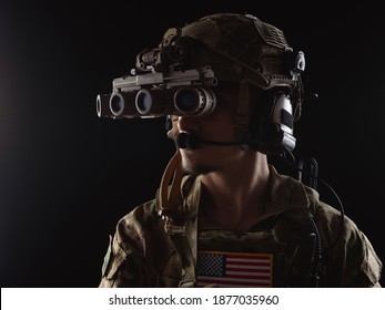 Delta Force soldier, US army special forces. Combat application group, Army compartmented element operator - Tier 1. Portrait on a black backdrop with rifle and night vision.