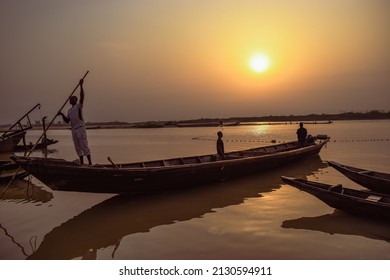 Delta State, Nigeria - December 9, 2021: African Fishermen Setting Out For Fishing Adventure. Fishery Business In Africa.
Fishing Boats By A River Bank. Reflection On A Water Surface.