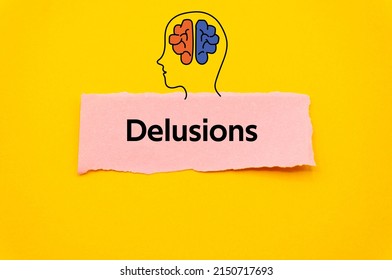Delusions.The word is written on a slip of colored paper. Psychological terms, psychologic words, Spiritual terminology. psychiatric research. Mental Health Buzzwords.