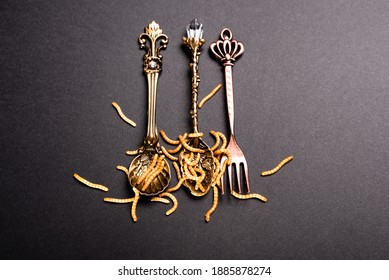 Deluxe retro-style cutlery feeds protein-rich worms, future-feeding insects. - Shutterstock ID 1885878274