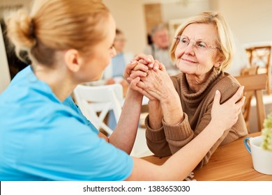 Demented Or Ill Senior Woman Is Being Comforted By A Geriatric Nurse In The Nursing Home