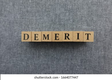 'DEMERIT' word made with wooden blocks - Shutterstock ID 1664077447