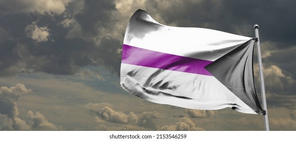 The demisexual flag, in which the black chevron represents asexuality, gray represents gray asexuality and demisexuality, white represents sexuality, and purple represents community