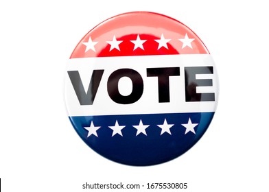 Democracy, presidential election and voting poll concept with red, white and blue vote glossy button pin with stars and stripes isolated on white background with clipping path cutout