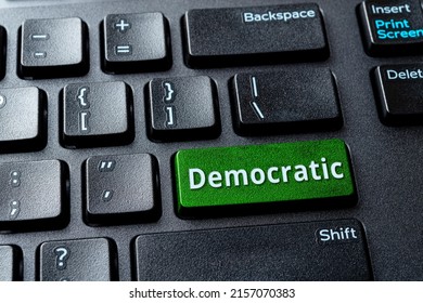 Democratic Green Key On A Black Desktop Keyboard. Concept Of Voting Online For Democratic Party, United States Elections And Politics. PC Computer Laptop Enter Key With Democratic Word Message. 