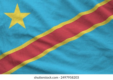 Democratic Republic of the Congo flag depicted on folded wavy fabric of old cloth close up - Powered by Shutterstock