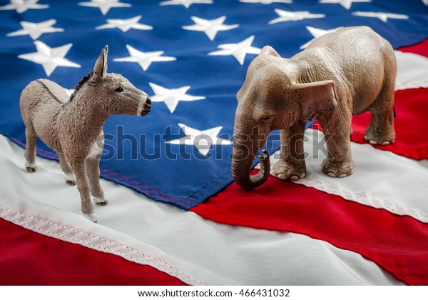 Democrats vs\
republicans are facing off in a ideological duel on the american\
flag. In American politics US parties are represented by either the\
democrat donkey or republican\
elephant