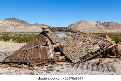 Demolished Ruins Old Wooden Vintage Log Cabin, Historic Wild West Mining Rhyolite Ghost Town. Scenic Desert Landscape Death Valley National Park, California USA - Powered by Shutterstock