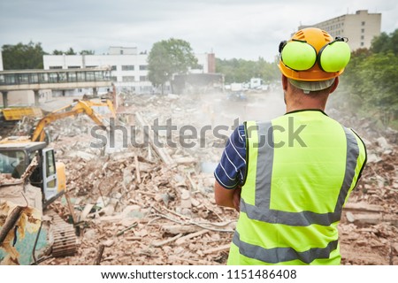 Demolition construction work. Worker at building site