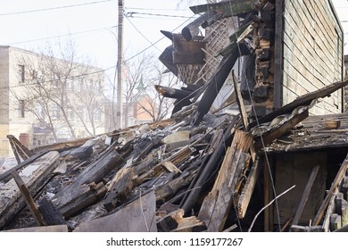 Demolition House Using Excavator In City. Rebuilding Process. Remove Equipment.