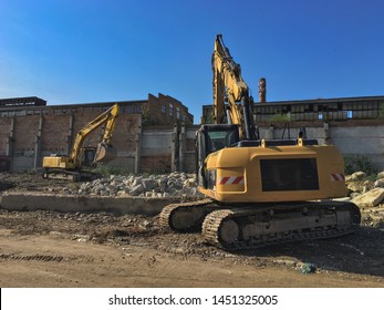 Demolition House Using Excavator In City. Rebuilding Process. Remove Equipment.