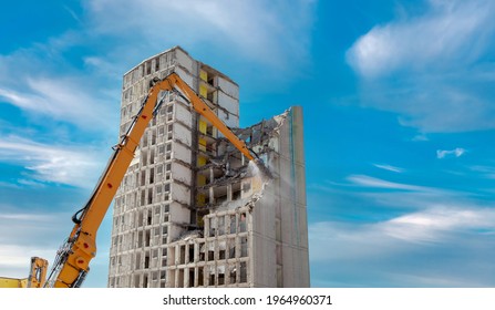 Demolition of the old building with sloopkraan. residential house, highrise building at construction site against blue clouds sky. Inner city demolition of High rise building in Mainz, Germany - Shutterstock ID 1964960371