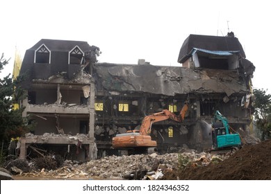 Demolition Of An Old Building. Tearing Down Concrete Buildings.