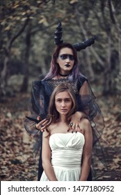 Demoness Going To Sacrifice The Bride In Magic Autumn Forest. Ritual With Virgin