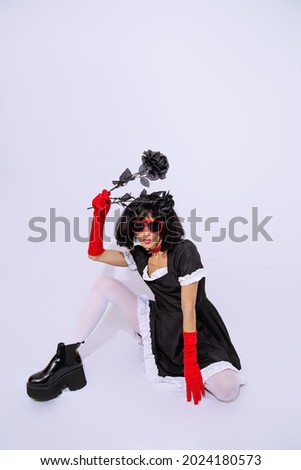 Demonic gothic stylish brunette Lady posing in white studio. Role-playing games, halloween, party shop accessories concept