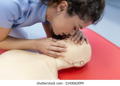 Demonstrating CPR (Cardiopulmonary Resuscitation) Training Medical Procedure On CPR Doll In The Class. Students Are Learning How To Rescue The Patient.First Aid For Safe Life Concept.