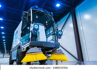 Demonstration of harvesting equipment. A road sweeper. Vehicle for street cleaning. Machine with yellow brushes for cleaning. 