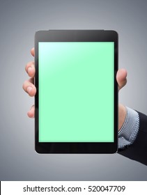 Demonstration Of The Mockup Tablet In The Man's Hand. Clipping Path Included.