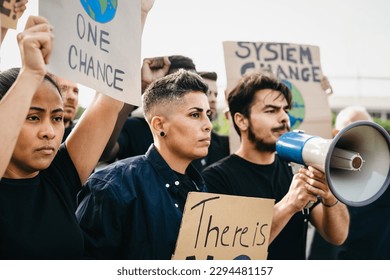 Demonstration of multiracial activists protesting for climate change - Global warming concept