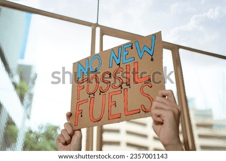 Demonstrator protesting against development of new fossil fuels