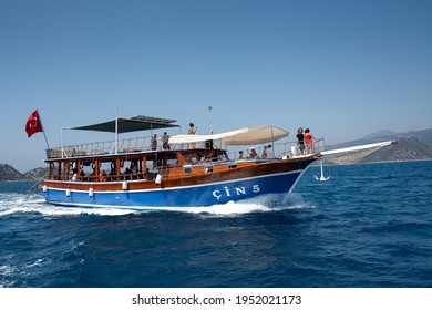 Demre, Turkey - 07.07.2020. Pleasure Yacht In The Sea. Tourist Ship With People On Board With Turkish Flag Sails On The Waves. Fast Moving Excursion Ship Boat.