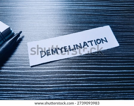 Demyelination writting on table background. 