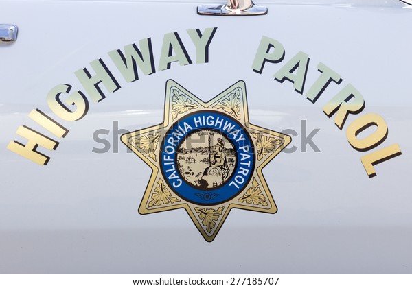 DEN BOSCH, NETHERLANDS - MAY\
10, 2015: California Highway Patrol sign on a vintage US police\
car.