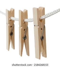Den Helder, Netherlands. July 2022. Wooden clothes pegs on a white background, isolated. Selective focus. High quality photo