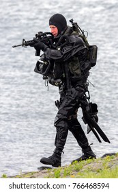 DEN HELDER, THE NETHERLANDS - JUN 23, 2013: Special Forces combat diver during an amphibious assault demo at the Dutch Navy Days.