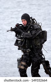 DEN HELDER, THE NETHERLANDS - JUNE 23: Dutch Special Forces combat diver during an amphibious assault demo during the Dutch Navy Days on June 23, 2013 in Den Helder, The Netherlands 