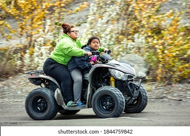 Denali, AK / USA / 9/5/2020: Alaskan Native Citizens Riding ATVs Weekend Family Fun