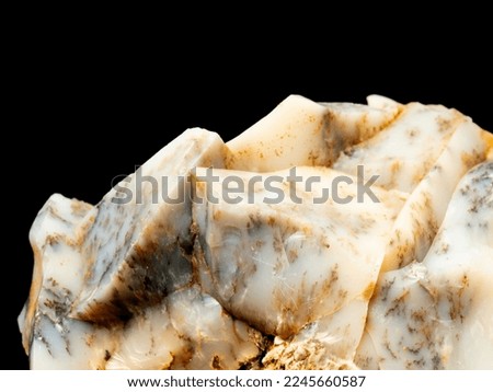 Dendritic opal. Opal on a black background. Opal is a hydrated amorphous form of silica. the mineral sample comes from Bohuskovice, Kremze, Czech Republic, Europe