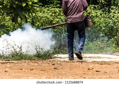 Dengue Can Be Prevented By Fumigation Mosquitoes Machine For Kill Mosquito Carrier Of Zika Virus, Spraying DDT, Insecticide So Mosquitoes Die. Prevalent Homes, Communities. Spraying Area Damp And Dark