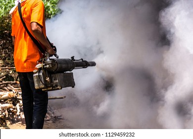 Dengue Can Be Prevented By Fumigation Mosquitoes Machine For Kill Mosquito Carrier Of Zika Virus, Spraying DDT, Insecticide So Mosquitoes Die. Prevalent Homes, Communities. Spraying Area Damp And Dark