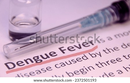 Dengue - diagnosis written on a white piece of paper.