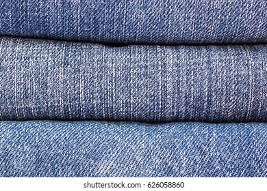 lot of denim blue jean texture is the classic indigo fashion. close-up of denim blue jeans, concept for fashion