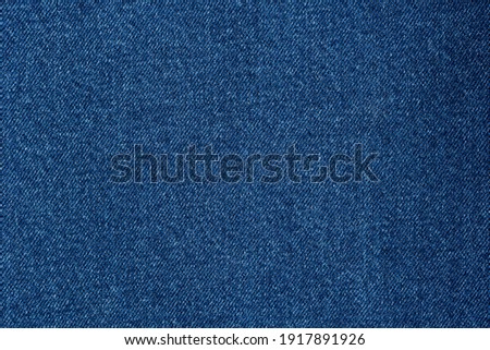 Denim blue jeans fabric. Denim background texture for design. Canvas denim. Blue jeans texture for any background.